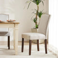 Chaise de salle à manger capitonnée de style moderne, avec bordure cloutée et pieds en bois massif